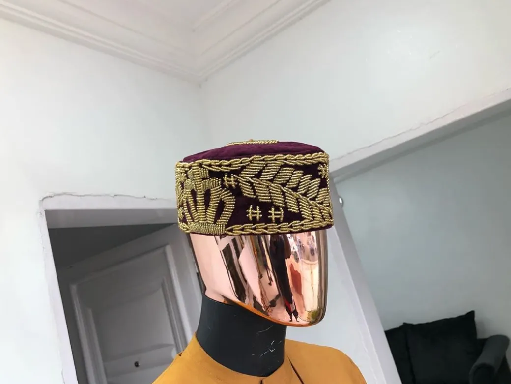 A Burgundy and gold embroidery African traditional hat