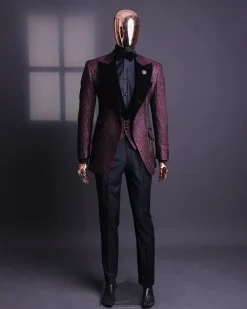 A burgundy, black broom splashed metallic jacquard, knitted, peak lapel tuxedo suit