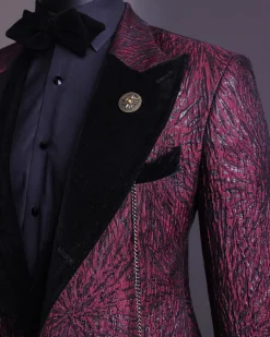 A burgundy, black broom splashed metallic jacquard, knitted, peak lapel tuxedo suit