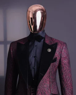 A burgundy, black broom splashed metallic jacquard, knitted, peak lapel tuxedo suit