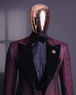 A burgundy, black broom splashed metallic jacquard, knitted, peak lapel tuxedo suit