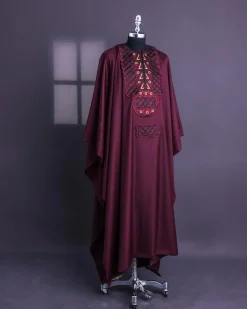 A Burgundy, Connected Ring With Gold Eyelet Details Agbada