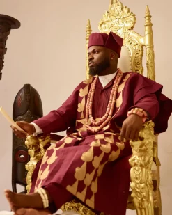 A Burgundy, deltagbada flapper embroidery details agbada