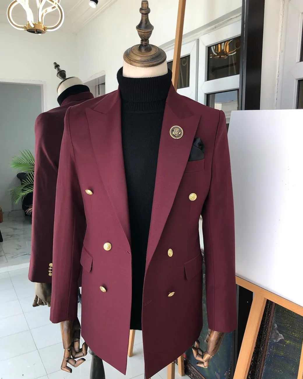 A Burgundy Double Breasted peak lapel with Gold Button suit