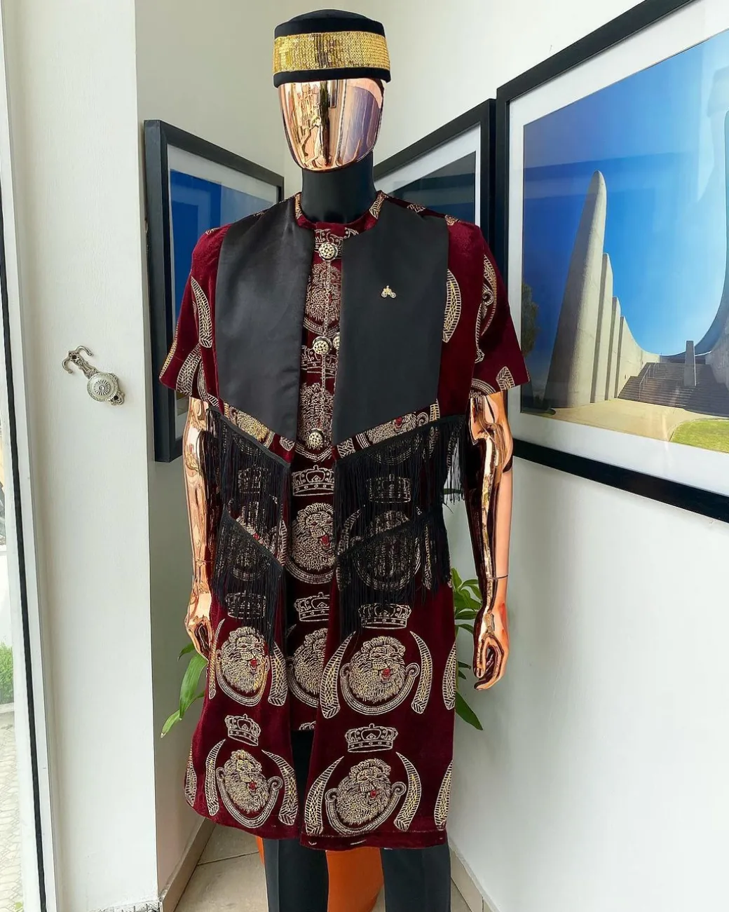 A burgundy Reloaded “isiagu” African traditional Wear with pant trouser
