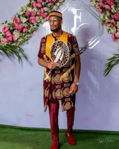A burgundy Reloaded “isiagu” African traditional Wear with pant trouser