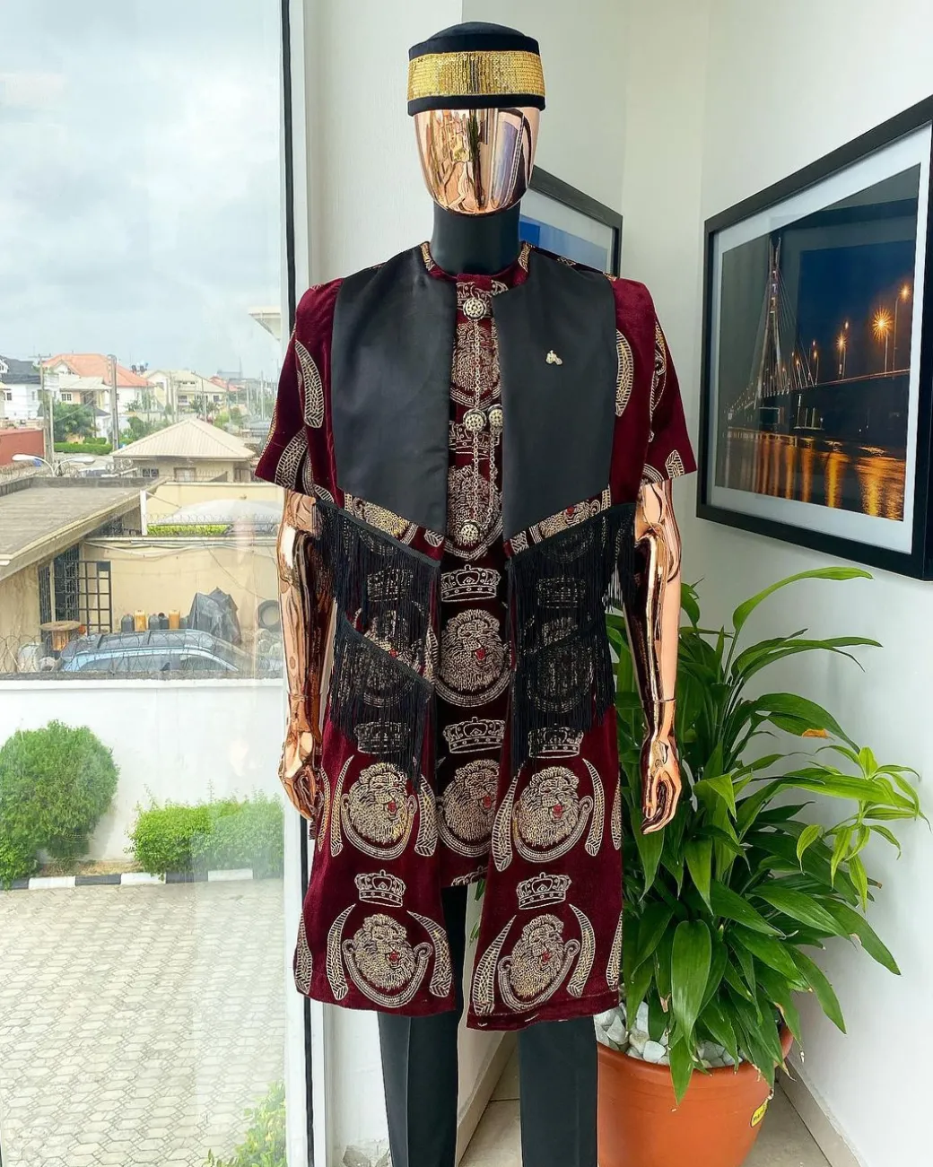 A burgundy Reloaded “isiagu” African traditional Wear with pant trouser
