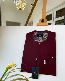 A Burgundy with a clear Swarovski button front flap African Kaftan