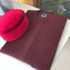 A Burgundy with a front flap African Kaftan and Red Velvet Hat