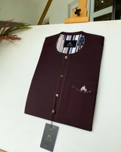 A burgundy with Swarovski button details African kaftan
