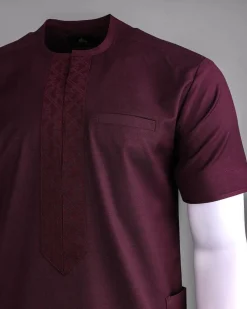 A Burgundy, zip line with arewa embroidery, shirt sleeve African senator kaftan native.