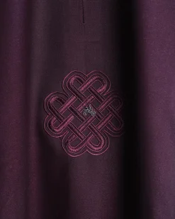 A burgundy, zipline with lower embroidery details, short sleeve African senator kaftan native.