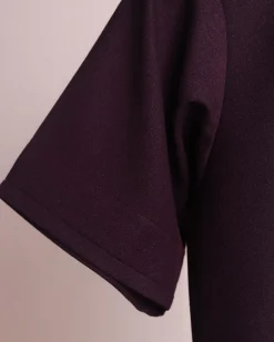 A burgundy, zipline with lower embroidery details, short sleeve African senator kaftan native.