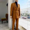 A Burnt Orange Double Breasted Peak Lapel Suit.