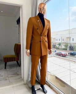 A Burnt Orange Double Breasted Peak Lapel Suit.