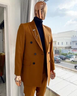A Burnt Orange Double Breasted Peak Lapel Suit.