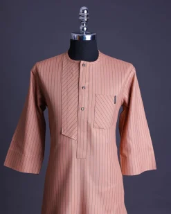 A Cantaloupe orange with a black pencil stripe and a front flap with black Swarovski buttons African senator, kaftan native