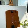 A caramel brown flap and pocket undulating with connected lane embroidery detailing African traditional senator Kaftan native