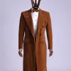 A Caramel brown, soaked velvet, peak lapel double breasted trench suit