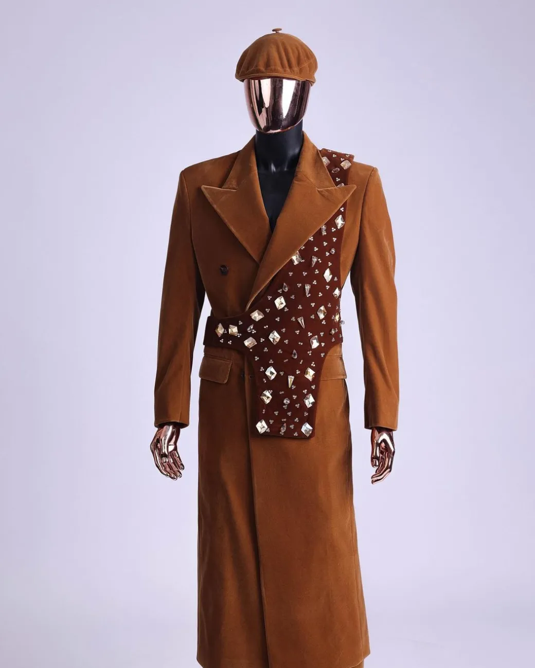 A Caramel brown, soaked velvet, peak lapel double breasted trench suit