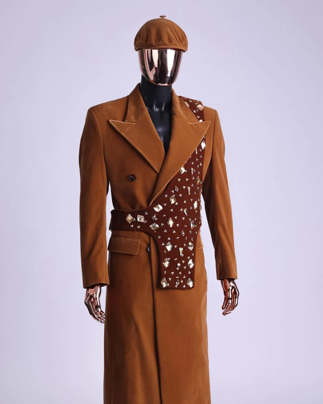 A Caramel brown, soaked velvet, peak lapel double breasted trench suit