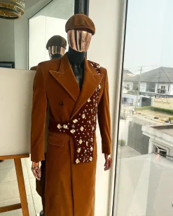 A Caramel brown, soaked velvet, peak lapel double breasted trench suit