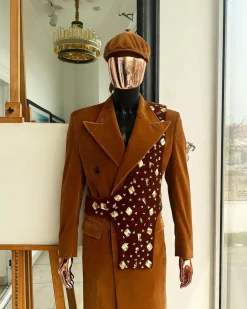 A Caramel brown, soaked velvet, peak lapel double breasted trench suit