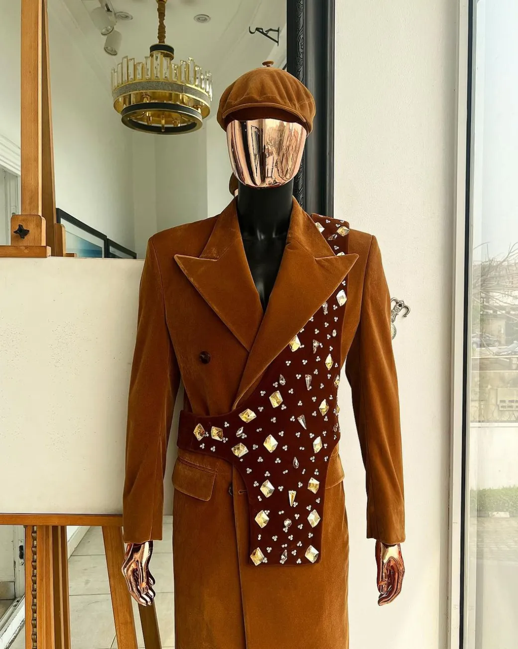 A Caramel brown, soaked velvet, peak lapel double breasted trench suit