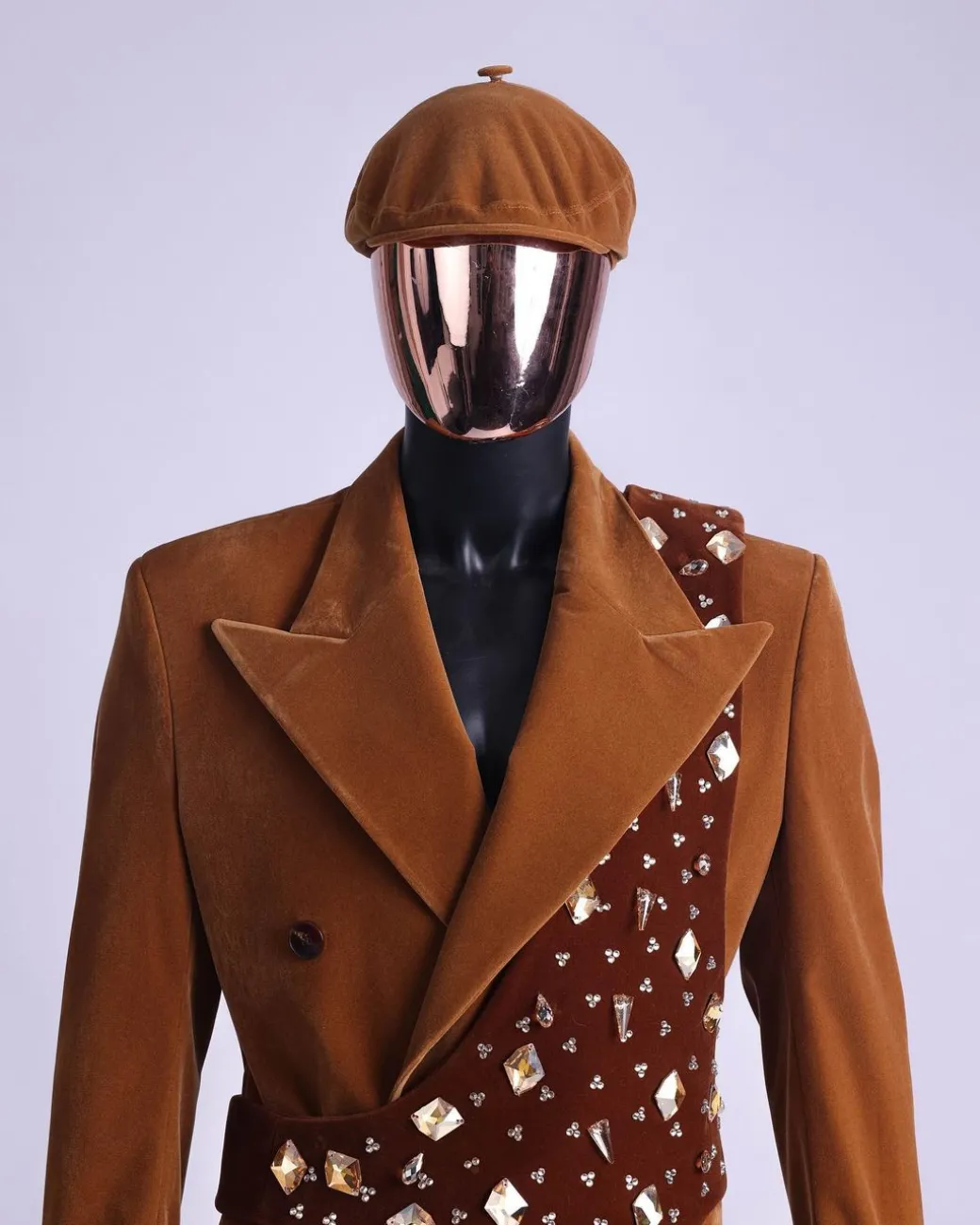 A Caramel brown, soaked velvet, peak lapel double breasted trench suit