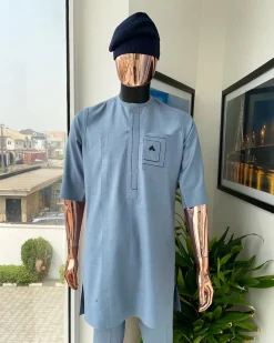 A Carolina blue, layered rectangle and square embroidery flap and pocket detailing african traditional senator kaftan native.