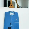 A cerulean blue, vertical Flap with Swarovski button on flap, related embroidery detailing African traditional senator kaftan native.