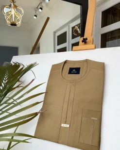 A Champagne Gold African kaftan with interlocking lane design and sokoto