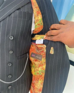 A charcoal black & white pencil stripe Jorgecarli ceremonial super 140’s “Board Room” notch lapel patch pocket suit