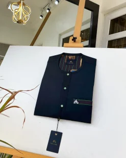 A charcoal black and green Kaftan with Swarovski detailing and sokoto