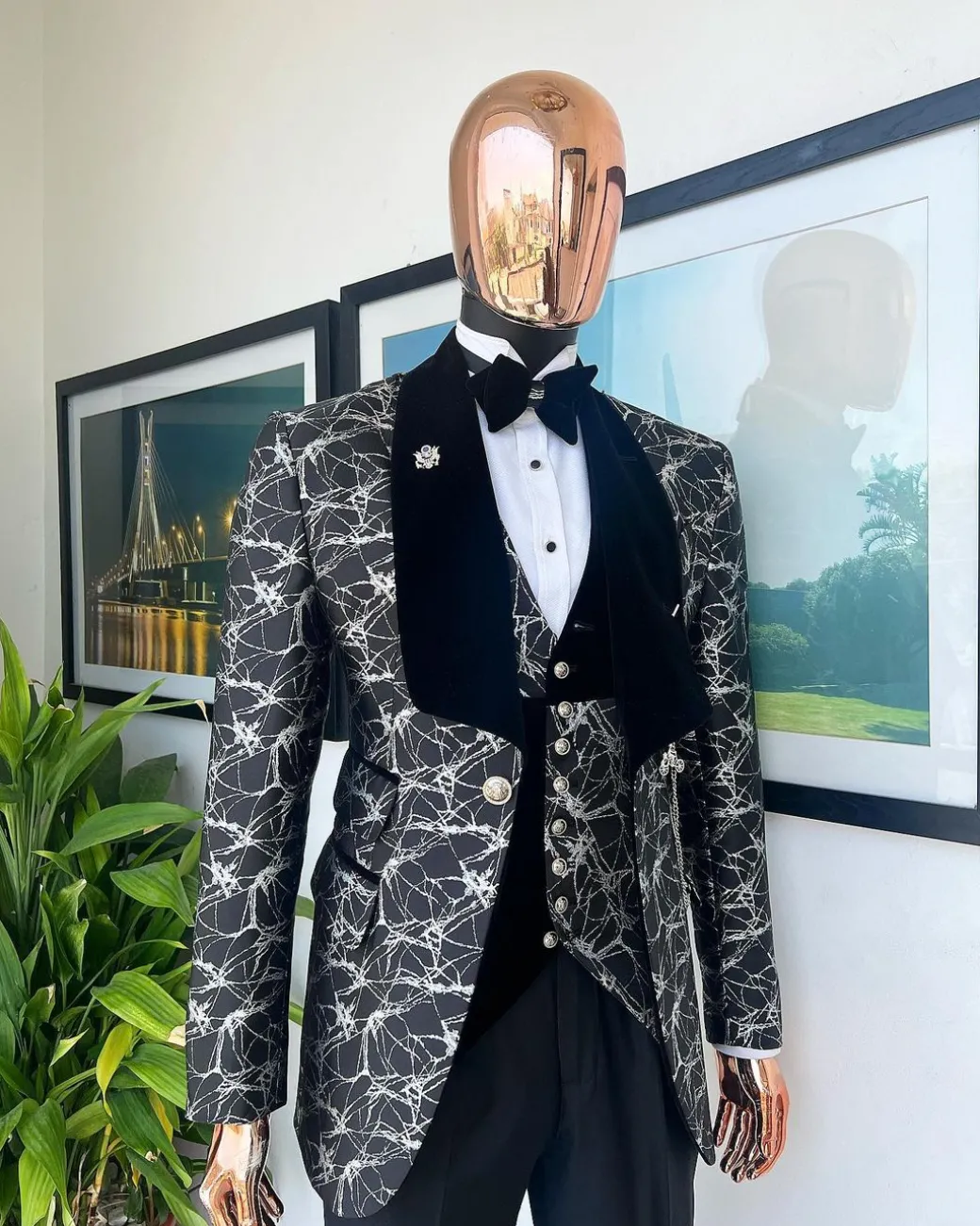 A charcoal black and silver spiral jacquard, shawl lapel tuxedo suit
