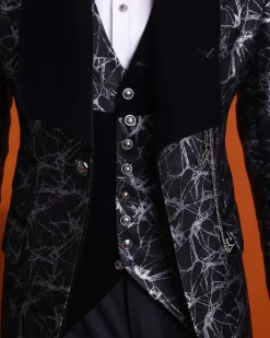 A charcoal black and silver spiral jacquard, shawl lapel tuxedo suit