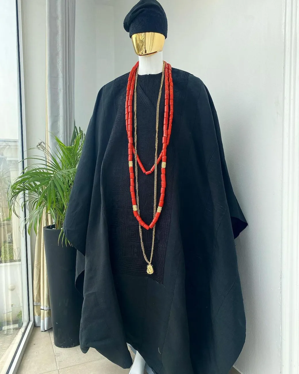 A charcoal black aso oke agbada with box patter embroidery design