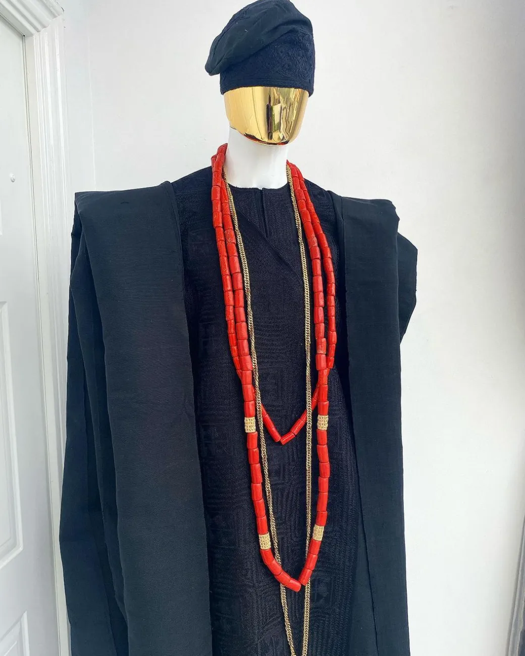 A charcoal black aso oke agbada with box patter embroidery design
