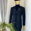 A charcoal black Bespoke reloaded “peaky blinders” peak lapel suit