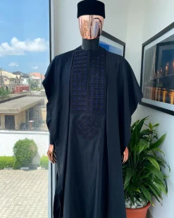 A Charcoal Black, Connected Square Embroidery Design with Blue Detailing Agbada