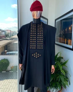 A charcoal black, connected square embroidery design with matching gold and red Swarovski stone details agbada