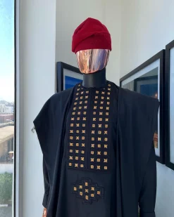 A charcoal black, connected square embroidery design with matching gold and red Swarovski stone details agbada
