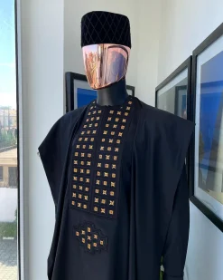 A charcoal black, connected square embroidery design with matching gold and red Swarovski stone details agbada