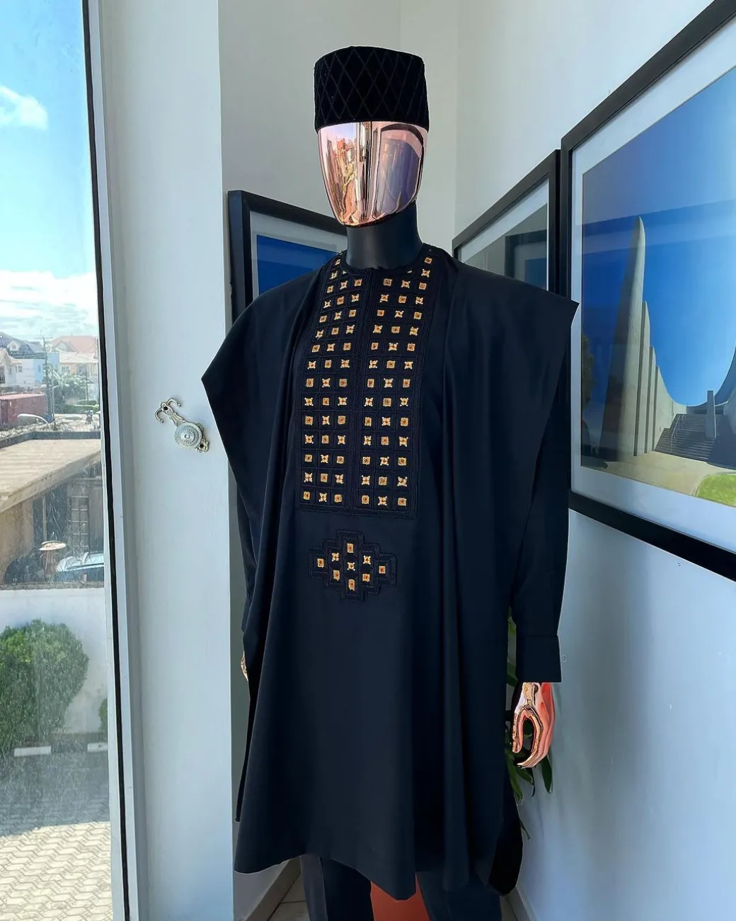 A charcoal black, connected square embroidery design with matching gold and red Swarovski stone details agbada