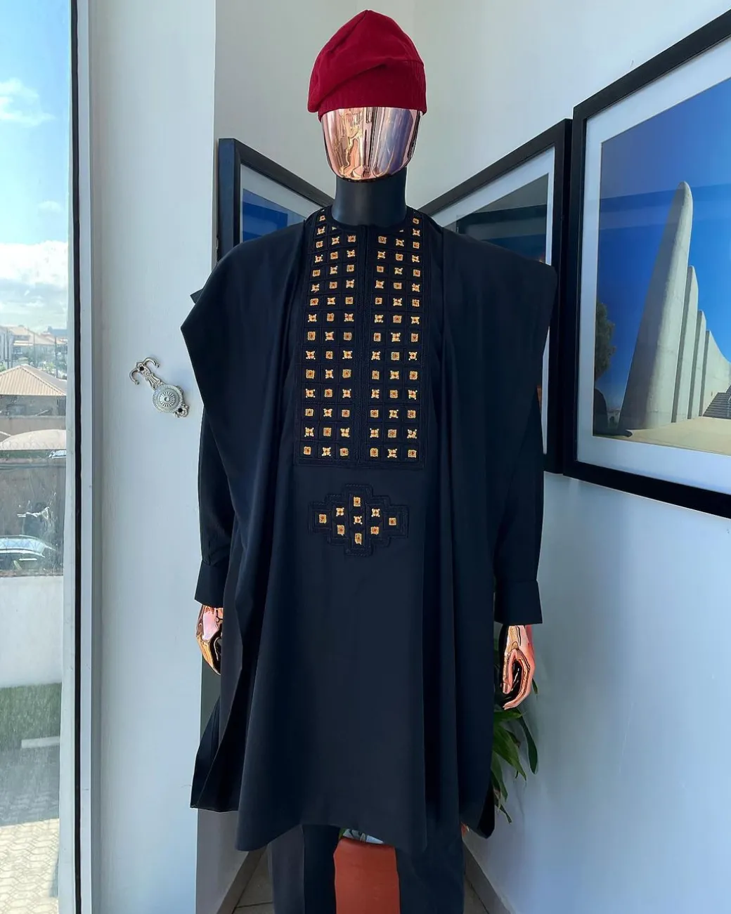 A charcoal black, connected square embroidery design with matching gold and red Swarovski stone details agbada