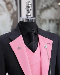 A charcoal black “contrast” pink notch lapel suit