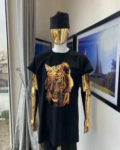 A charcoal black “daftan” with a tiger prints & black Fulani hat