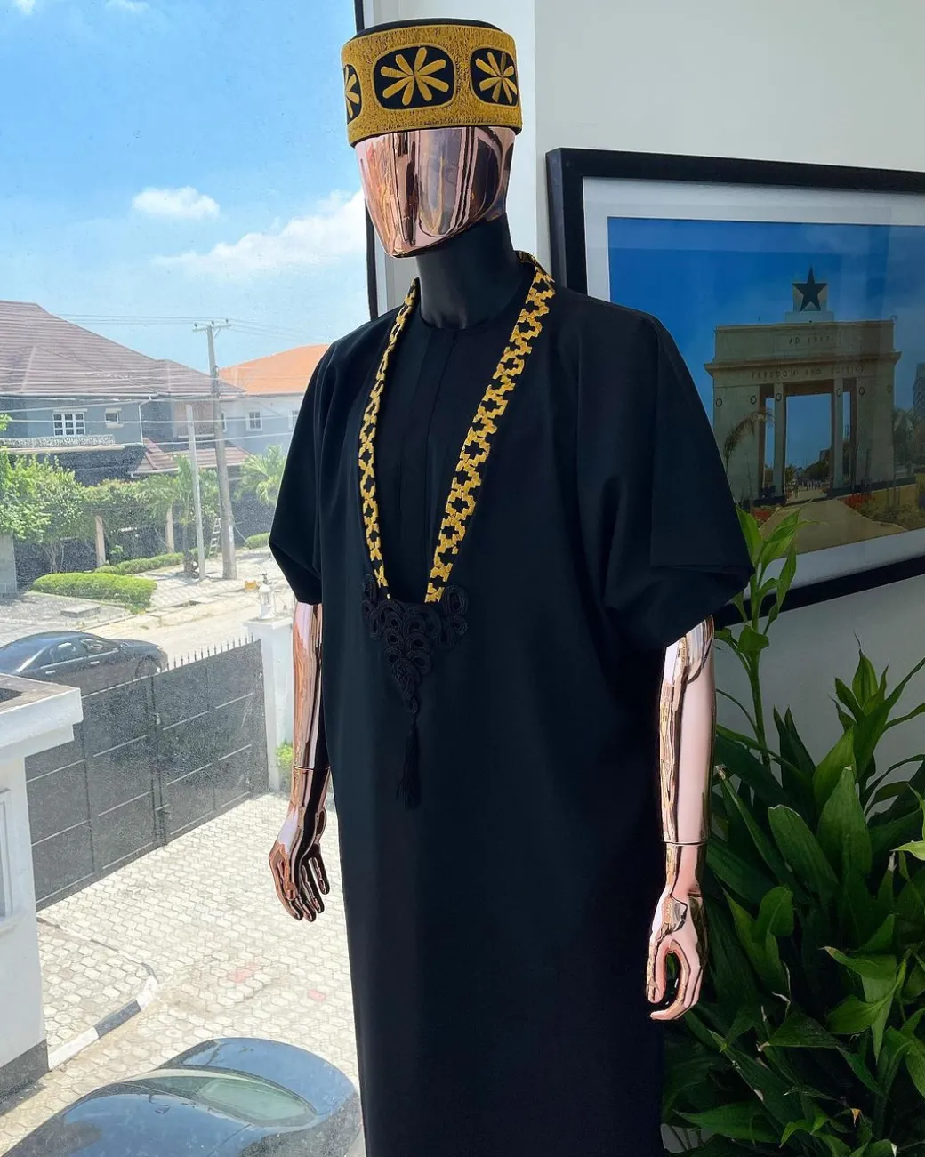 A charcoal black dagbtan, connected star gold embroidery detailing senator native.
