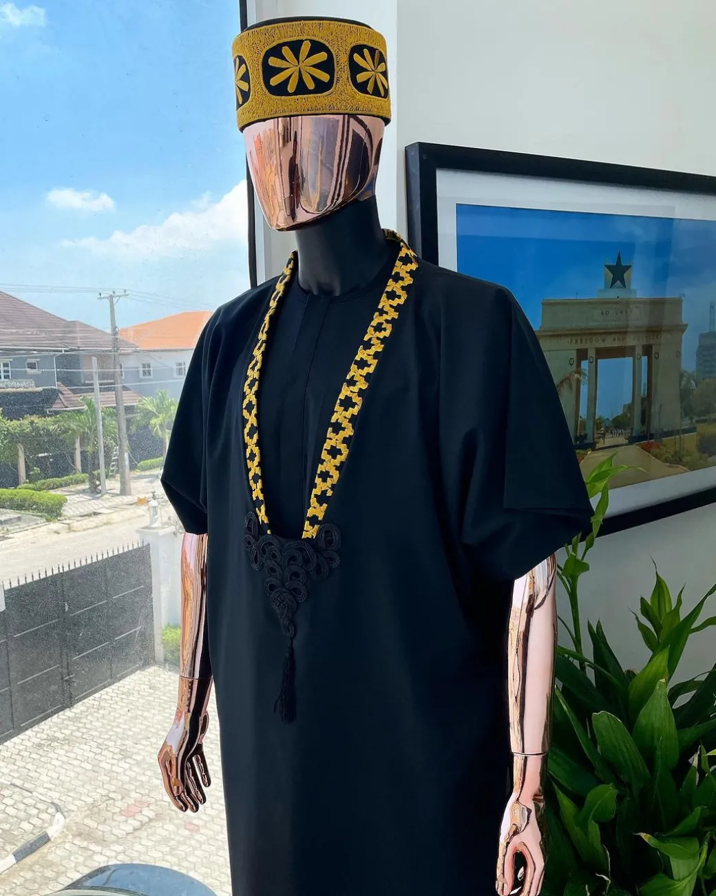 A charcoal black dagbtan, connected star gold embroidery detailing senator native.