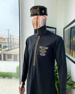 A charcoal black, dotted flap, kissing wave embroidery detailing hat and flap pocket traditional senator kaftan native